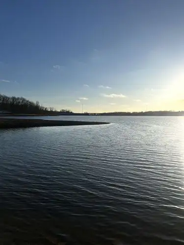 Serene waters reflecting the warm glow.
